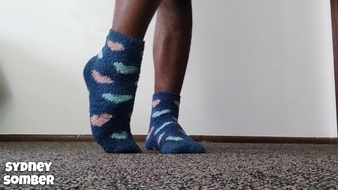 Arched feet in blue socks