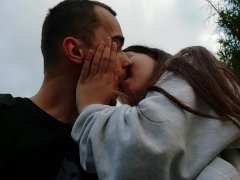 Kissing with beautiful girlfriend in the park