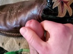 Cowboy cumming on his boots in black Wrangler jeans