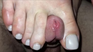 Teasing peehole with her long toenails and cumming on her sweaty soles