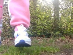 Cute girl is peeing outdoor