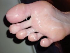 Eating cum off her oily soles after worshipping them