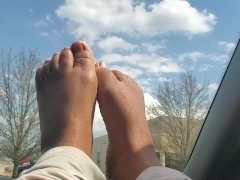 Petite bare feet on a sunny day