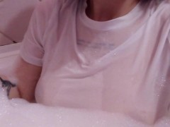 having fun in the bathtub with foam in a wet white top. I smoke and listen to 2rbina2rists