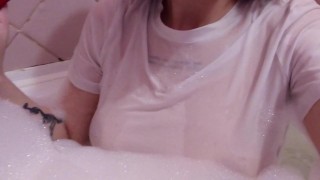 having fun in the bathtub with foam in a wet white top. I smoke and listen to 2rbina2rists