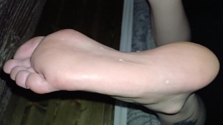 Eating cum off her oiled soles