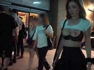 Sexy wife showing off tits to strangers on a crowded street