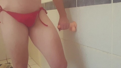 Sissy Femboy in red bikini having fun with a dildo