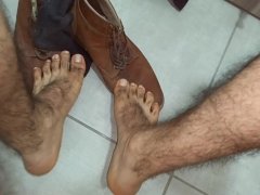 Male feet. Contemplating this lumberjack feet and hairy legs. Lick it or smell it?
