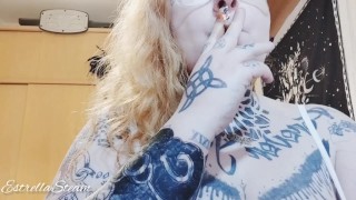 Tattooed girl smokes a cigarette