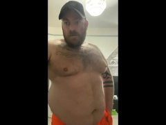Builder Danny Wyatt takes a smoke break showing off his big belly