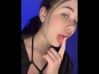 A cutie in a sexy outfit licks her toes. Video