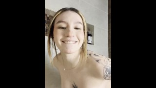Tattooed latina fucking herself at the shower