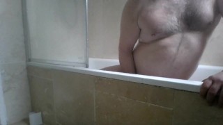 Masturbating and relaxing in a hot shower