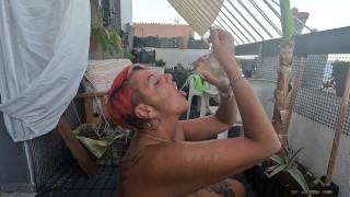 Cum & piss cocktail drinking from a condom