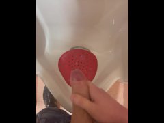 Jerking off into public urinal