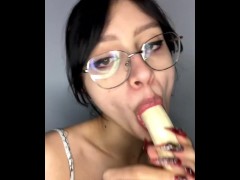 Girl with glasses gives a banana a blowjob...omg, looks like he got lucky