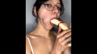 Girl with glasses gives a banana a blowjob...omg, looks like he got lucky