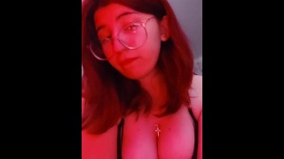 18-year-old girl touching her breasts on camera.