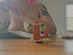 topless lego building with natural saggy tits