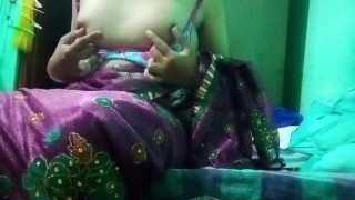 Indian Gay Crossdresser in pink saree pressing and milking his boobs so hard and enjoying the hardco