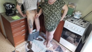 a fat woman jerks off my dick in the kitchen and I cum powerfully