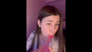 cute student with a dildo licks it juicy in front of the camera
