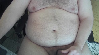 Chubby dad body playes with half hard cock again