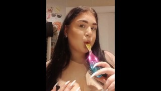cute college girl licks her new hairbrush juicy.
