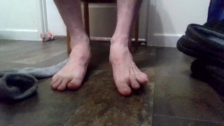 Taking slippers and socks off and rubbing dirty feet!!