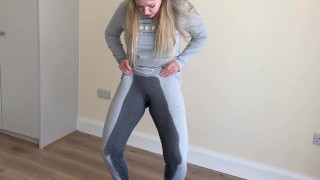 girl desperately peeing in her pajama pants