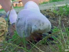 Sexy feet in nylon knee socks and dirty white socks teasing you closeup outdoor