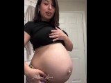 Hot pregnant girl oiling belly at 25 weeks