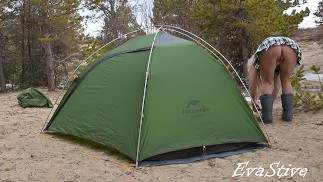 A gorgeous blonde without panties is assembling a tent. For lovers of peeping