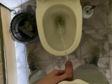 Long pissing of an uncircumcised penis in a public toilet POV