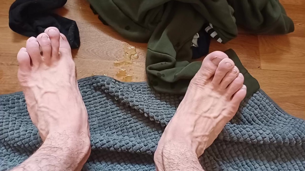 Veiny skinny long feet bitten toe nails after hot bath