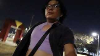 Crossdresser walking at night.