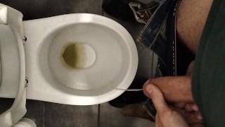 pissing in a public toilet