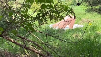 I caught a young beauty jerking off in a clearing and called her to ride on my dick