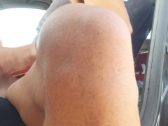 Sexy exhibitionist jerks off in car in a risky way with people passing by