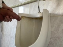 Guy pees with big uncut dick in public toilet
