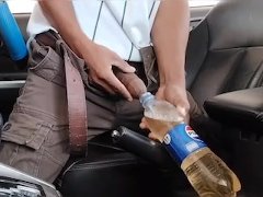 Emergency: Peeing into a water bottle in the car (Coke color)