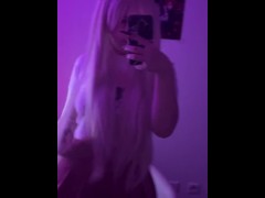 Cute cat-girl stroking herself on her leg with hair