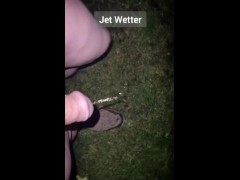 Nonchalant handsfree outdoor peeing in the back garden