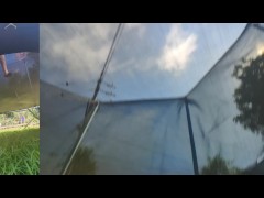 Tall girl in shorts jumping barefooted on a trampoline (slowed down) bottom view