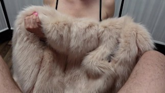 Dominant mistress in fur gives edging handjob