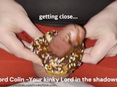 Big dick pushes through frosty donut and big balls make a huge cumshot