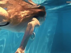 Perfect body blonde teen enjoys naked swimming