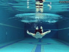 Czech babe Lady Dee takes her shorts off in the pool