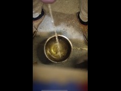 Desperate no hands nonchalant peeing into a bowl while standing 5/16
